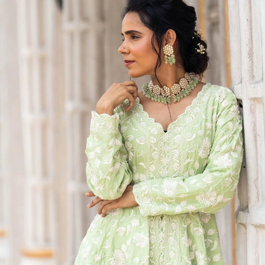 Green satin organza peplum with heavy satin lehenga pallazo