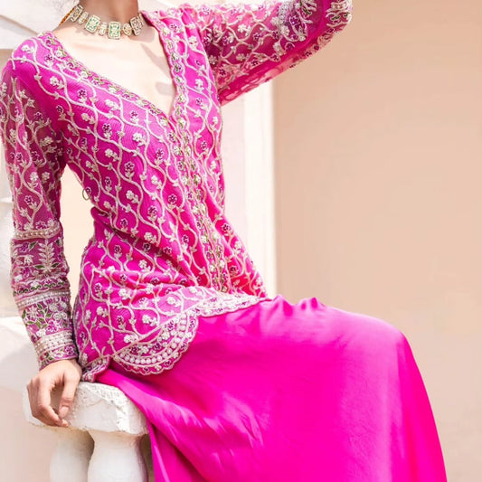 Pink swiss net peplum top with heavy satin lehenga pallazo