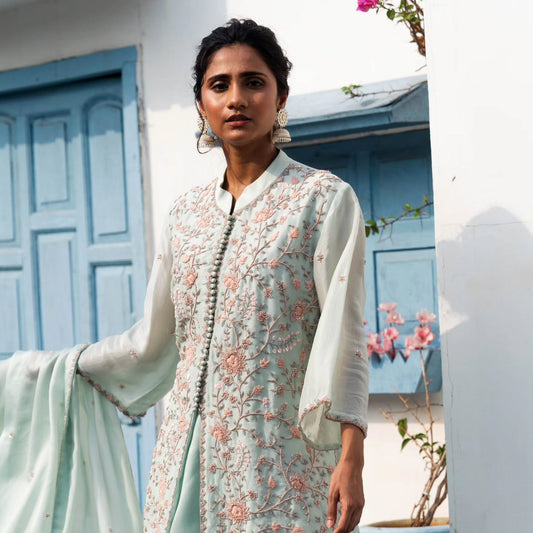 Light green upada silk peplum top with heavy satin lehenga pallazo