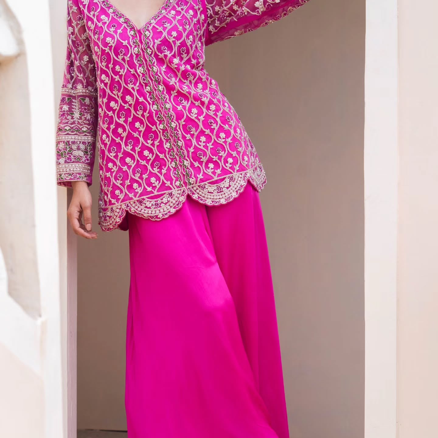 Pink swiss net peplum top with heavy satin lehenga pallazo