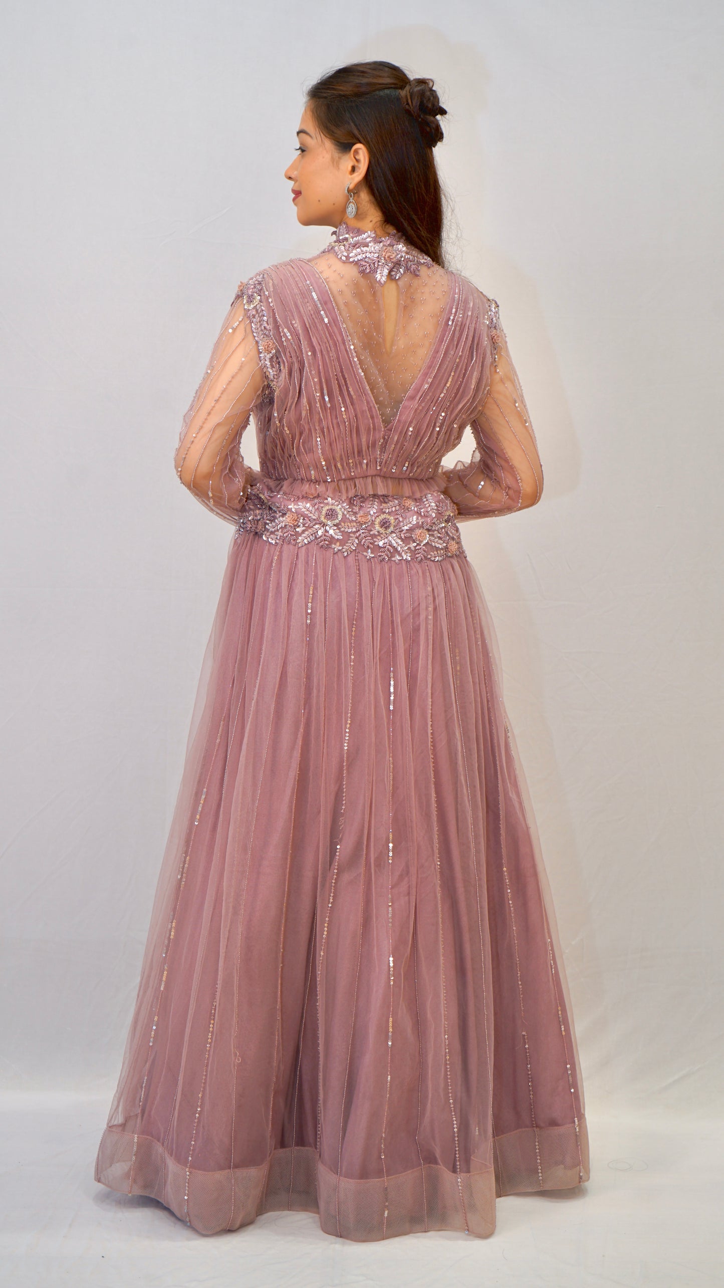 Purple turtle neck blouse with heavy net lehenga