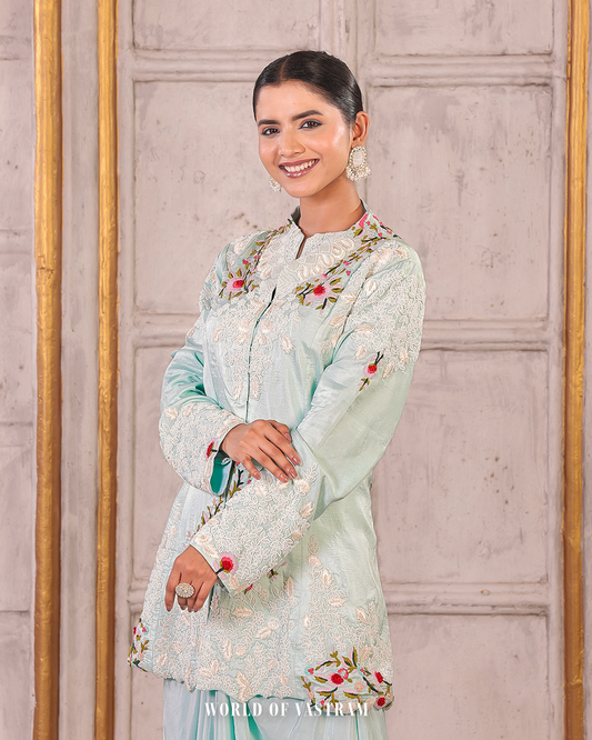 Powder blue peplum topwith draped skirts